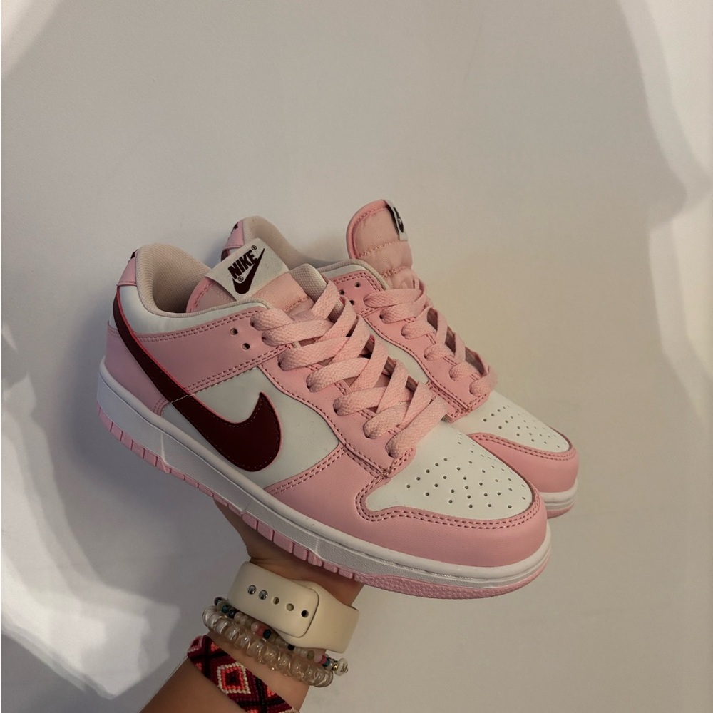 Nike Pink and White Athletic Shoes with High-Top Design